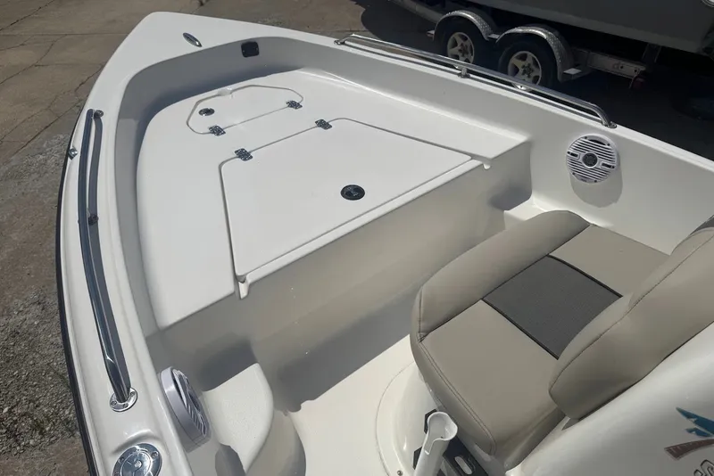 Slide: The Image of 2027 Key West 1720 Center Console boat interior with seating and storage compartments. - 16