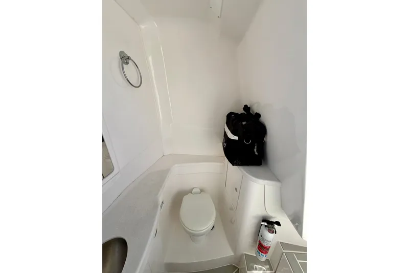 Slide: The Image of Compact bathroom in 2023 Intrepid 427 Nomad FE boat with toilet and storage. - 26