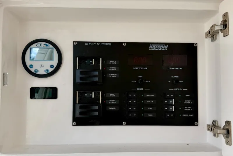 Slide: The Image of 2023 Intrepid 427 Nomad FE electrical panel with VTE display and AC system controls. - 29