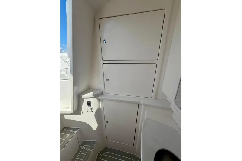 Slide: The Image of Interior storage compartments of 2023 Intrepid 427 Nomad FE boat. - 27