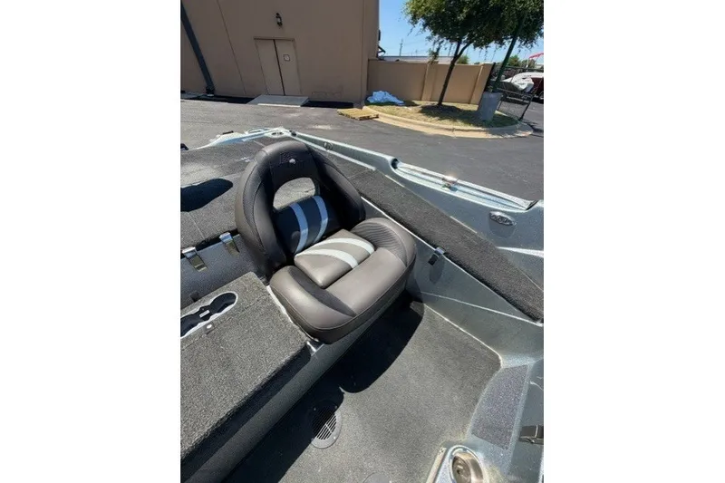 Slide: The Image of 2018 Bass Cat Caracal boat interior with a sleek, comfortable seat design. - 11