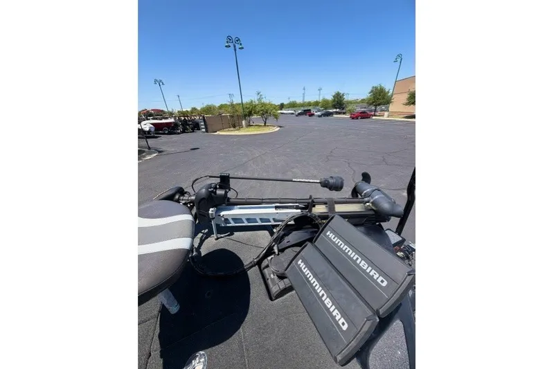 Slide: The Image of 2018 Bass Cat Caracal boat with Humminbird electronics in a parking lot. - 10