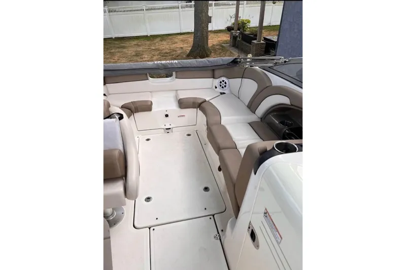 Slide: The Image of 2011 Yamaha Boats SX240 HO interior with beige seating and white flooring. - 3
