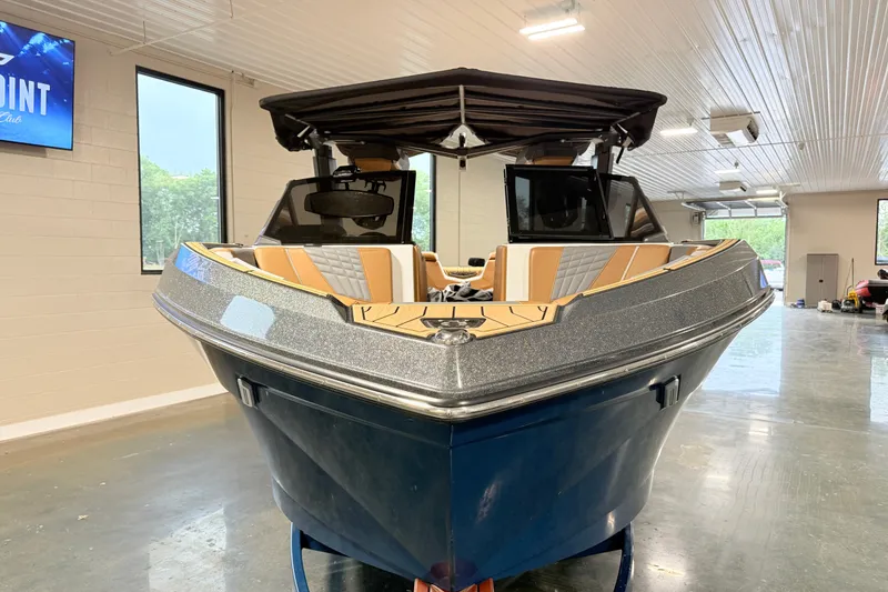 Slide: The Image of 2022 Nautique Super Air Nautique S23 boat in showroom, front view. - 10