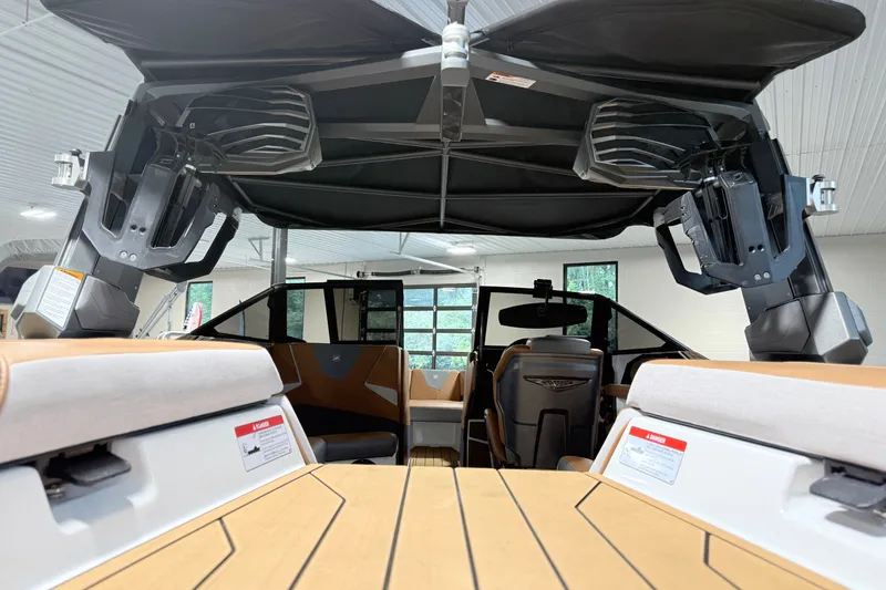 Slide: The Image of 2022 Nautique Super Air Nautique S23 interior with advanced sound system and sleek design. - 13
