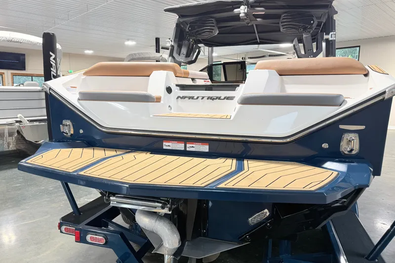 Slide: The Image of 2022 Nautique Super Air Nautique S23 boat with sleek design and modern features. - 4