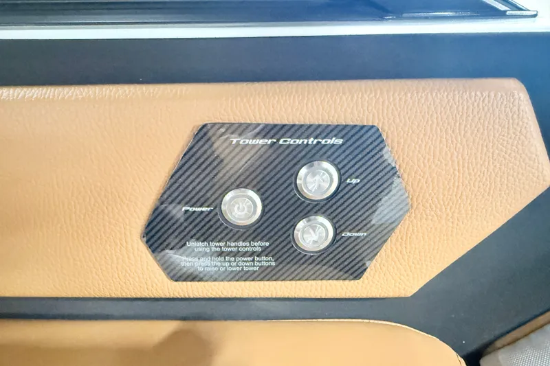 Slide: The Image of 2022 Nautique Super Air Nautique S23 tower controls on tan interior panel. - 20