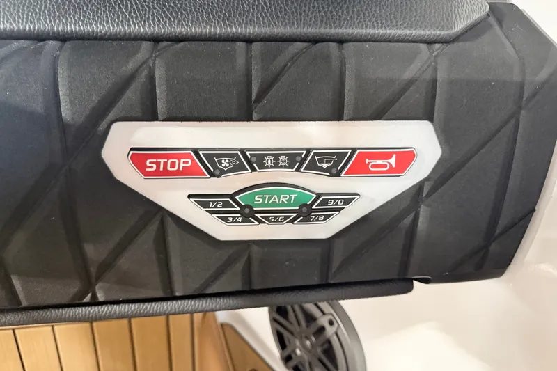Slide: The Image of Control panel of 2022 Nautique Super Air Nautique S23 with start and stop buttons. - 33