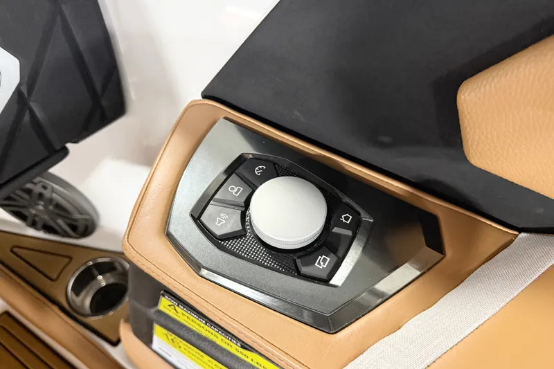 Slide: The Image of Control panel of 2022 Nautique Super Air Nautique S23 boat, featuring sleek design and buttons. - 22