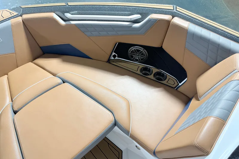 Slide: The Image of Luxurious interior of 2022 Nautique Super Air Nautique S23 boat with tan seating. - 27