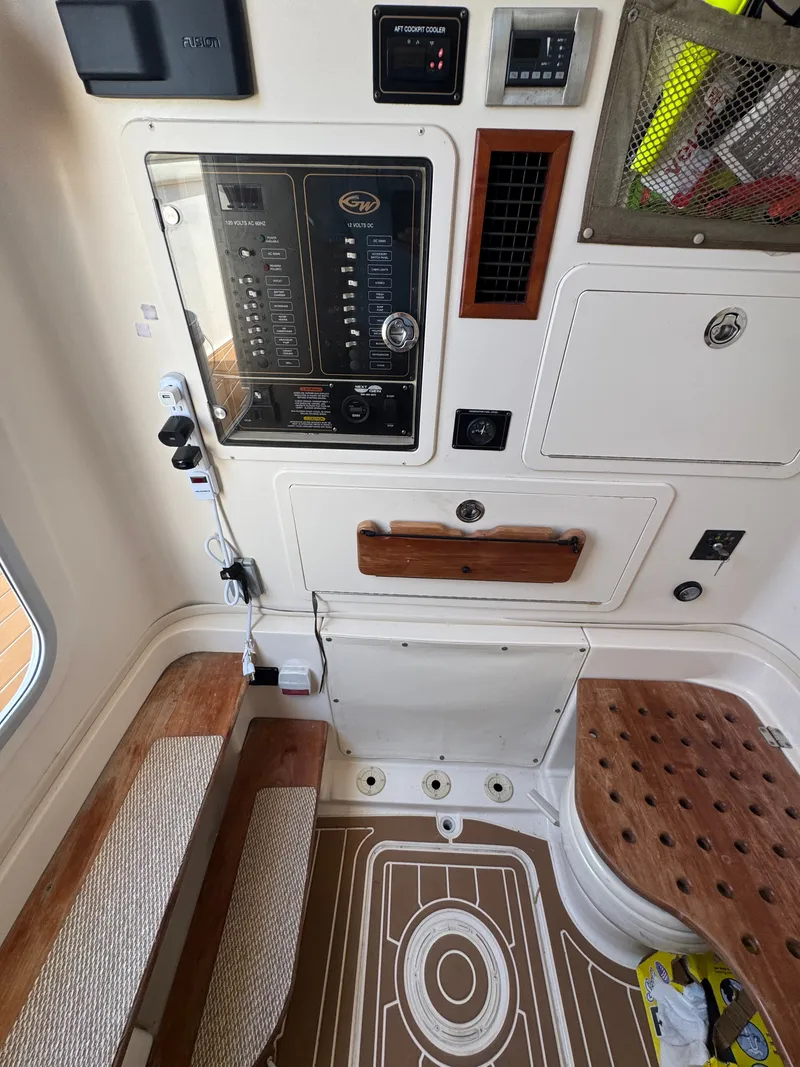 Slide: The Image of Interior view of a 2016 Grady-White Canyon 336 with control panel and seating area. - 27