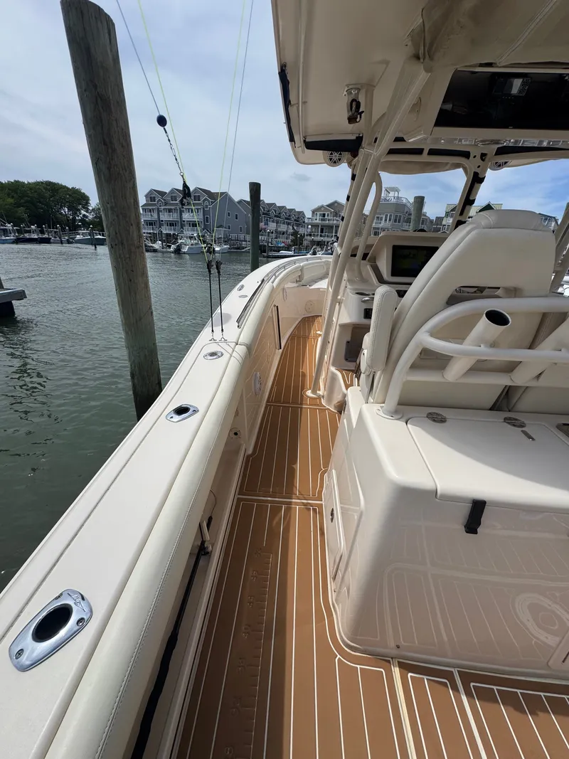 Slide: The Image of 2016 Grady-White Canyon 336 at dock with sleek interior and modern electronics. - 19