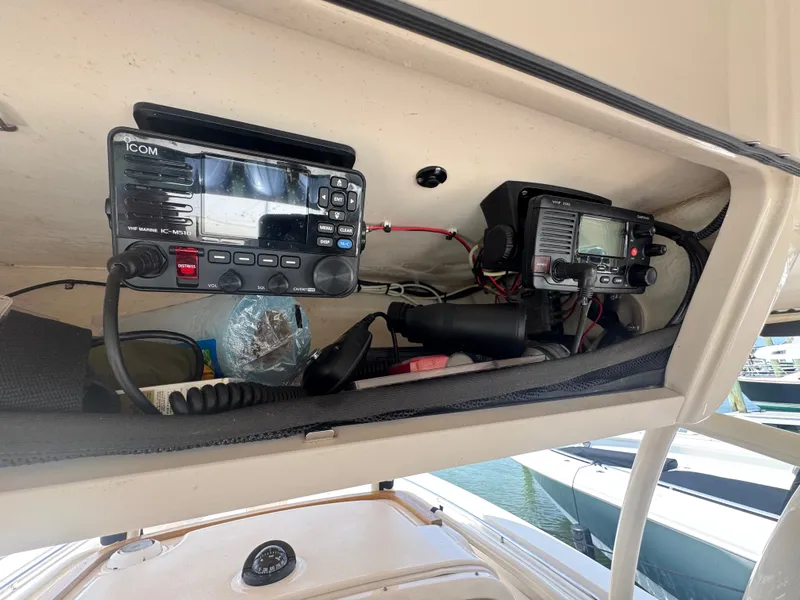 Slide: The Image of The image shows electronic equipment in a 2016 Grady-White Canyon 336 boat. - 12
