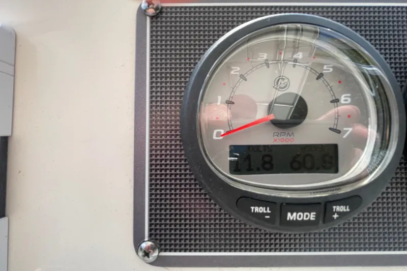 Slide: The Image of Close-up of a 2023 Boston Whaler 190 Montauk tachometer displaying RPM and voltage. - 4