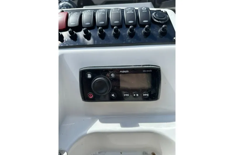 Slide: The Image of Control panel of a 2021 Edgewater 170CC boat with Fusion MS-RA55 stereo system. - 7