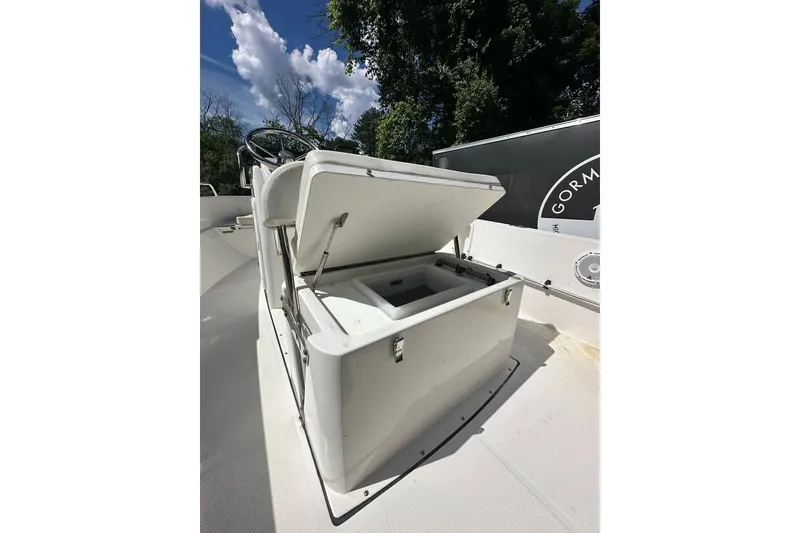 Slide: The Image of 2021 Edgewater 170CC boat with open storage compartment, showcasing interior space. - 10