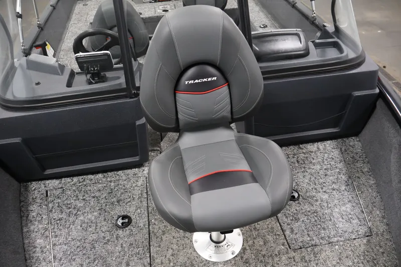Slide: The Image of 2025 Tracker Pro Guide V-175 WT boat interior with a gray captain's chair. - 16
