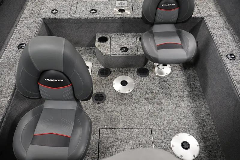 Slide: The Image of Interior of 2025 Tracker Pro Guide V-175 WT boat with gray seating and carpeted flooring. - 35