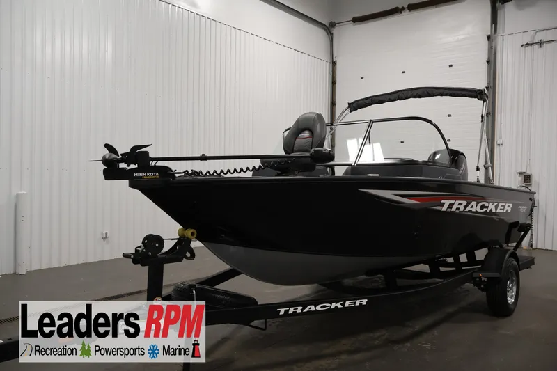 The Image of 2025 Tracker Pro Guide V-175 WT boat in showroom, featuring Minn Kota trolling motor. - 1