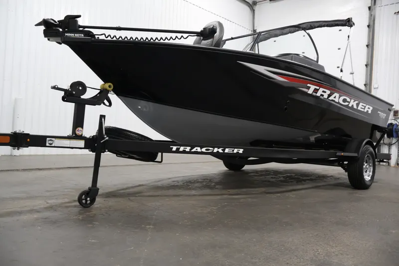 Slide: The Image of 2025 Tracker Pro Guide V-175 WT boat on trailer in indoor setting. - 51
