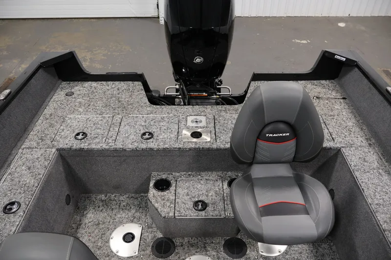 Slide: The Image of 2025 Tracker Pro Guide V-175 WT boat interior with gray seating and storage compartments. - 36