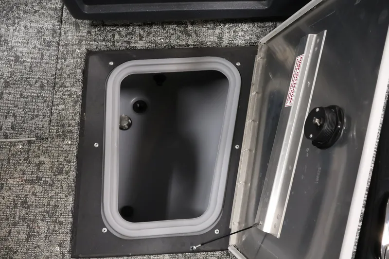 Slide: The Image of Open storage compartment in 2025 Tracker Pro Guide V-175 WT boat, featuring durable interior design. - 18