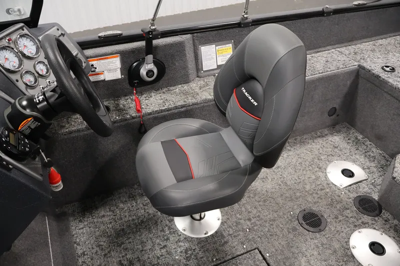 Slide: The Image of 2025 Tracker Pro Guide V-175 WT boat interior with steering wheel and cushioned seat. - 29