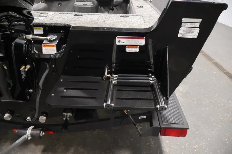 Slide: The Image of 2025 Tracker Pro Guide V-175 WT boat with rear boarding ladder and safety warnings. - 43