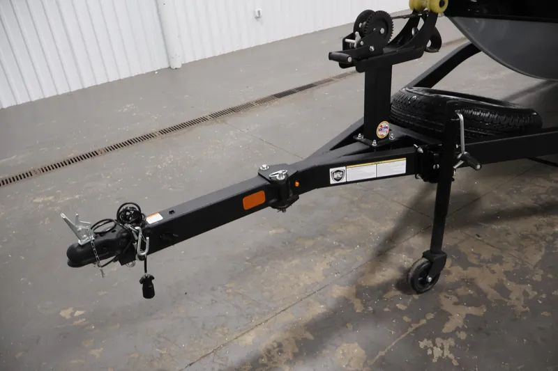 Slide: The Image of Trailer hitch of 2025 Tracker Pro Guide V-175 WT boat in a garage setting. - 49