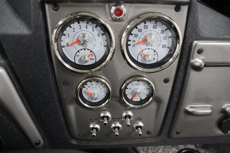 Slide: The Image of Dashboard of 2025 Tracker Pro Guide V-175 WT with gauges and controls. - 26