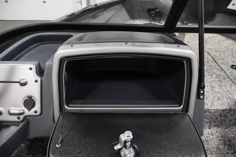 Slide: The Image of 2025 Tracker Pro Guide V-175 WT boat dashboard with storage compartment and control panel. - 32