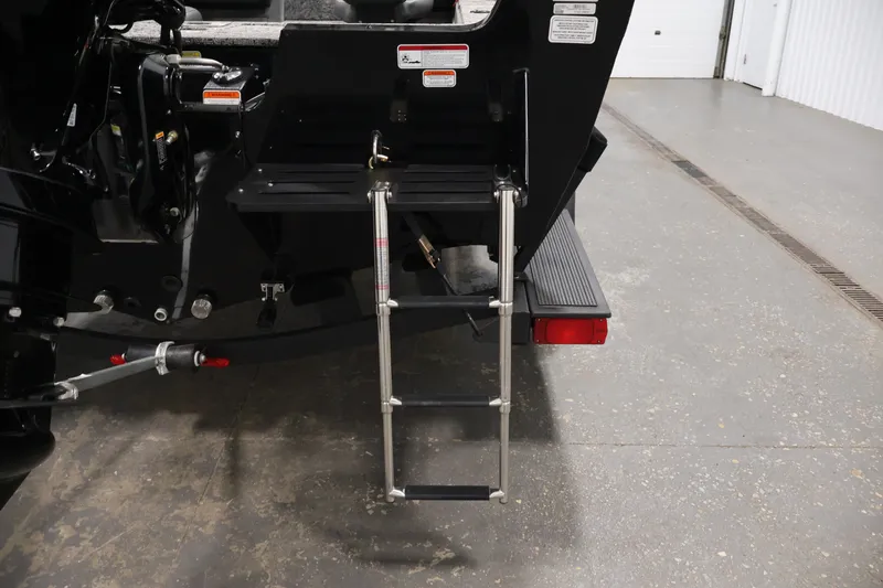 Slide: The Image of Rear view of 2025 Tracker Pro Guide V-175 WT boat with ladder and motor details. - 44
