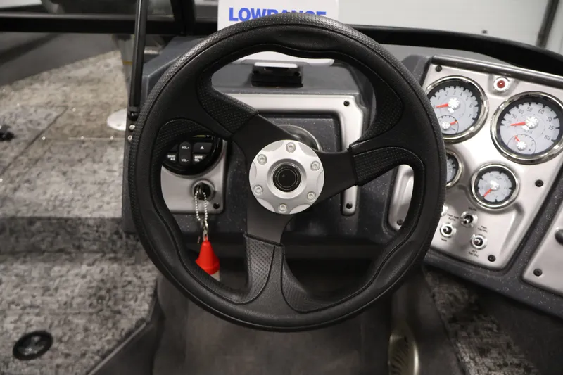Slide: The Image of Steering wheel and dashboard of 2025 Tracker Pro Guide V-175 WT boat. - 22