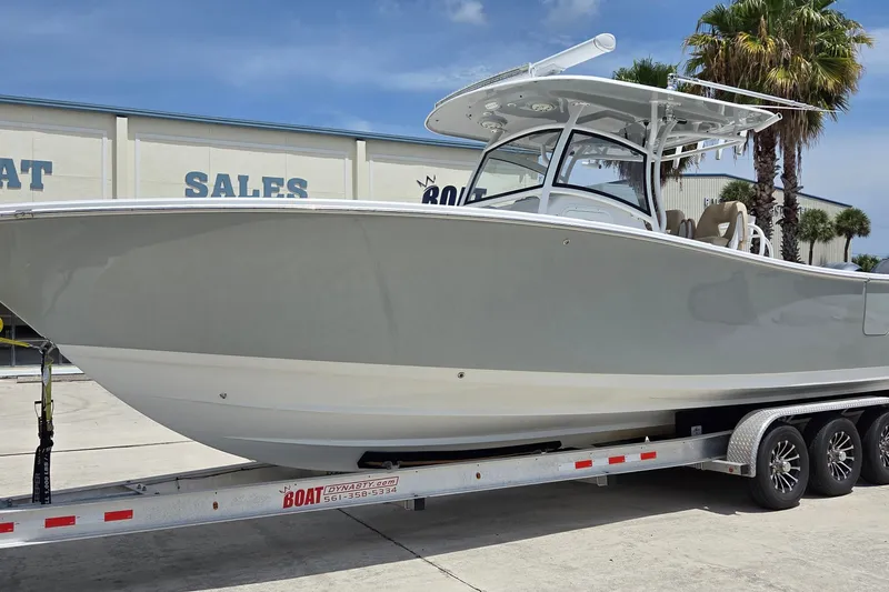 Slide: The Image of 2018 Sportsman Open 312 Center Console boat on trailer at sales lot. - 3