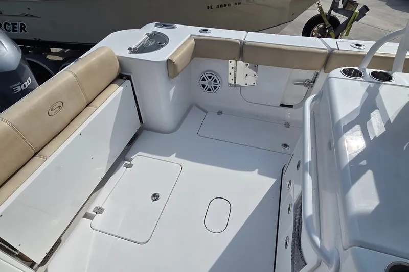 Slide: The Image of 2018 Sportsman Open 312 Center Console boat interior with seating and storage compartments. - 25