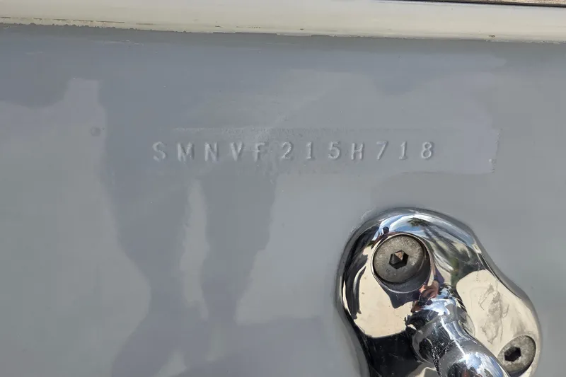 Slide: The Image of 2018 Sportsman Open 312 Center Console hull identification number and chrome fitting. - 28