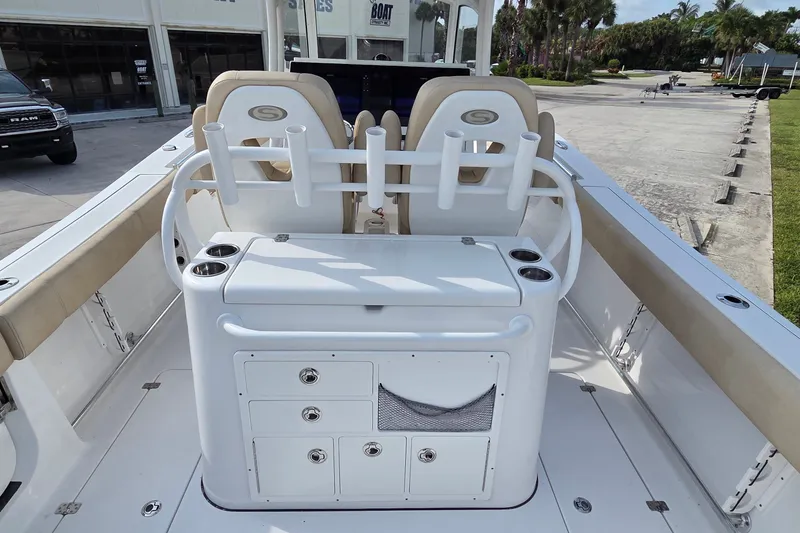 Slide: The Image of 2018 Sportsman Open 312 Center Console boat interior with seating and storage compartments. - 12