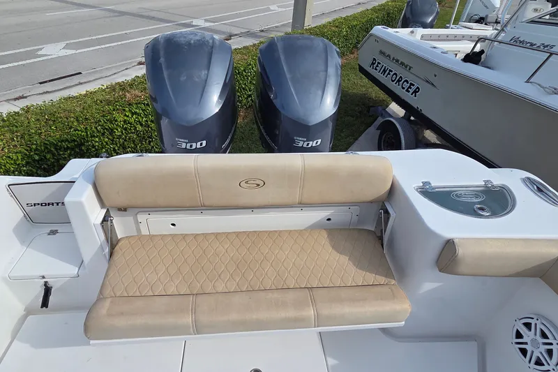 Slide: The Image of 2018 Sportsman Open 312 Center Console with twin Yamaha 300 engines and cushioned seating. - 16