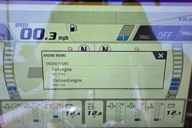 Slide: The Image of Display screen of a 2018 Sportsman Open 312 Center Console showing engine hours and speed. - 18