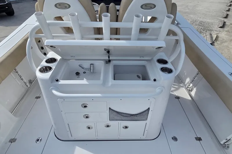 Slide: The Image of 2018 Sportsman Open 312 Center Console boat with sink and rod holders. - 14