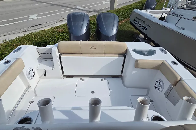 Slide: The Image of 2018 Sportsman Open 312 Center Console boat with dual engines and spacious seating area. - 11