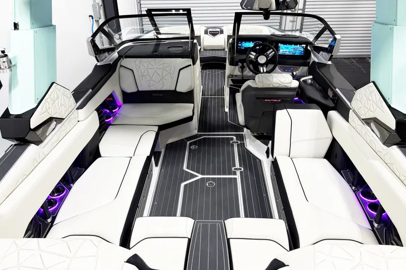 Slide: The Image of Luxurious interior of 2023 Nautique Super Air Nautique G23 Paragon boat with ambient lighting. - 10