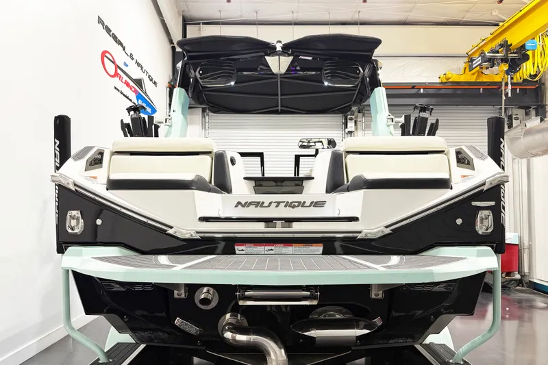 Slide: The Image of 2023 Nautique Super Air Nautique G23 Paragon boat in showroom, rear view. - 5