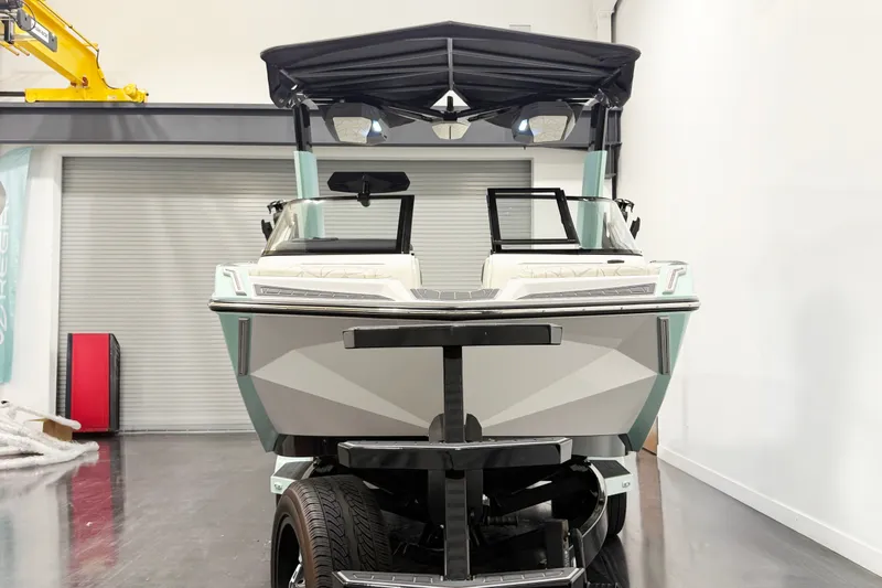 Slide: The Image of 2023 Nautique Super Air Nautique G23 Paragon boat in showroom, front view. - 3