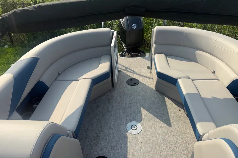 Slide: The Image of 2025 Trifecta 24 RF LE pontoon boat interior with plush seating and modern design. - 10