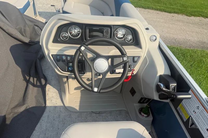 Slide: The Image of Steering console of 2025 Trifecta 24 RF LE boat with gauges and controls. - 7