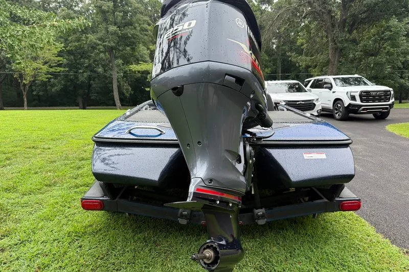 Slide: The Image of 2018 Skeeter FX20 Limited Edition boat with powerful outboard motor on grassy lawn. - 3