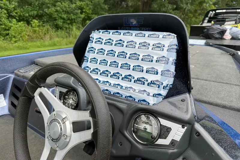 Slide: The Image of 2018 Skeeter FX20 Limited Edition boat dashboard with steering wheel and gauges. - 12