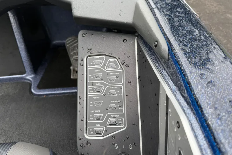 Slide: The Image of Control panel of a 2018 Skeeter FX20 Limited Edition boat, wet with raindrops. - 16