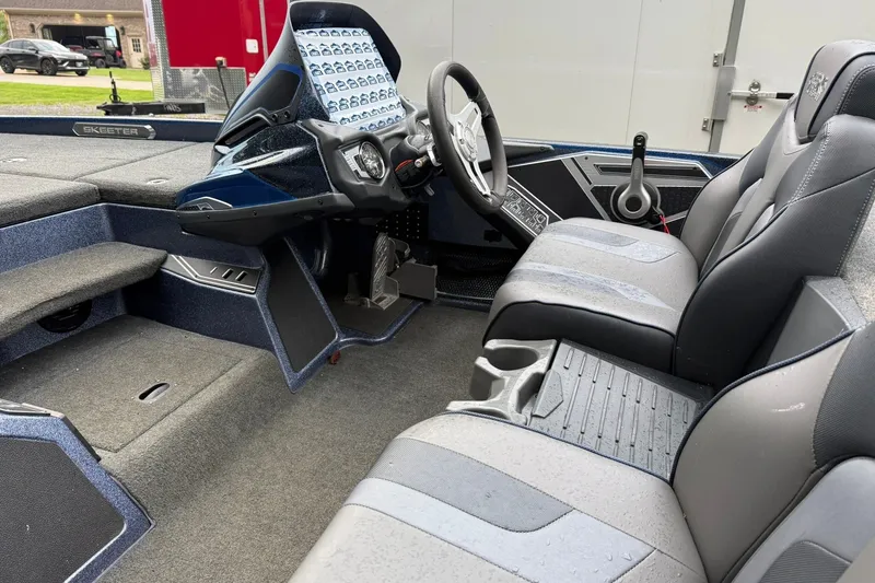 Slide: The Image of 2018 Skeeter FX20 Limited Edition boat interior with steering wheel and seating. - 8